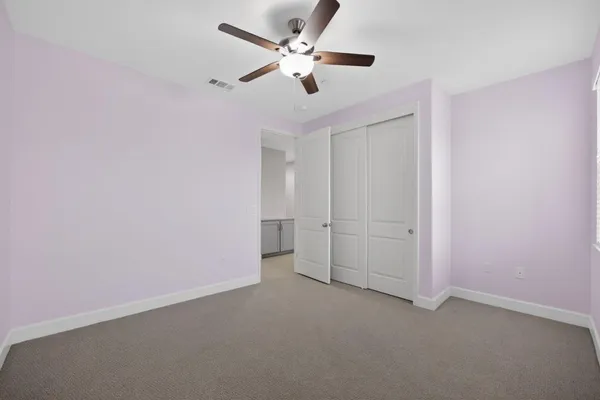 a bedroom with a bed furniture and a flat screen tv