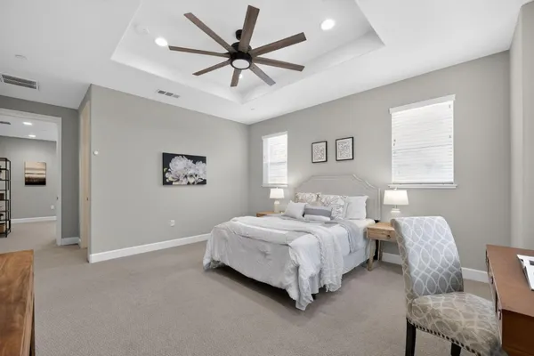 a bed room with a bed and a chair