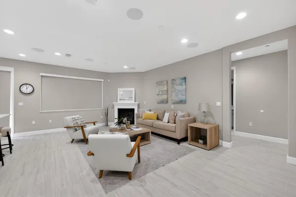 a living room with furniture and a fireplace