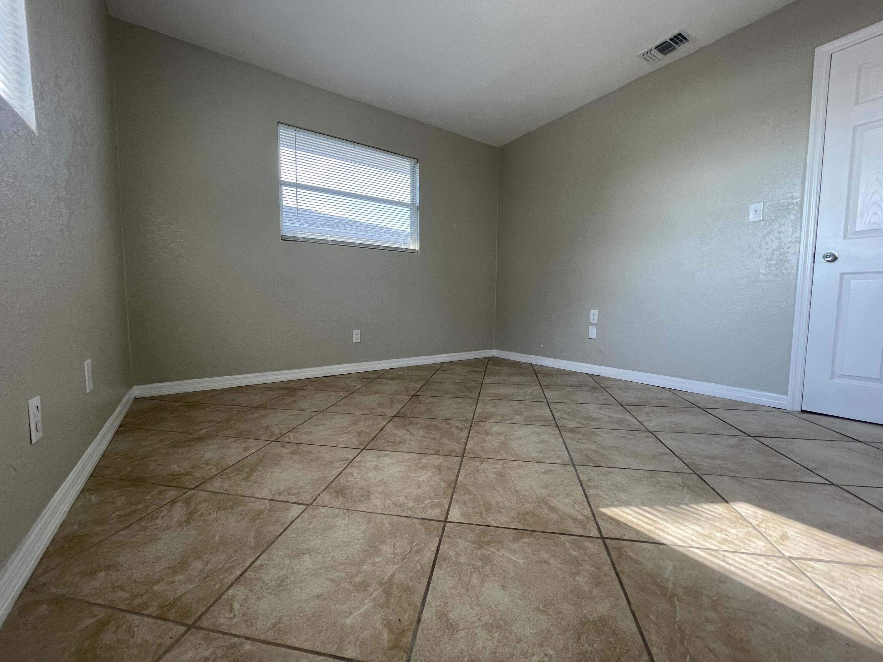 2880 Harson Way Fort Pierce, FL 34946 - Photo 38 of 40 a view of an empty room and window
