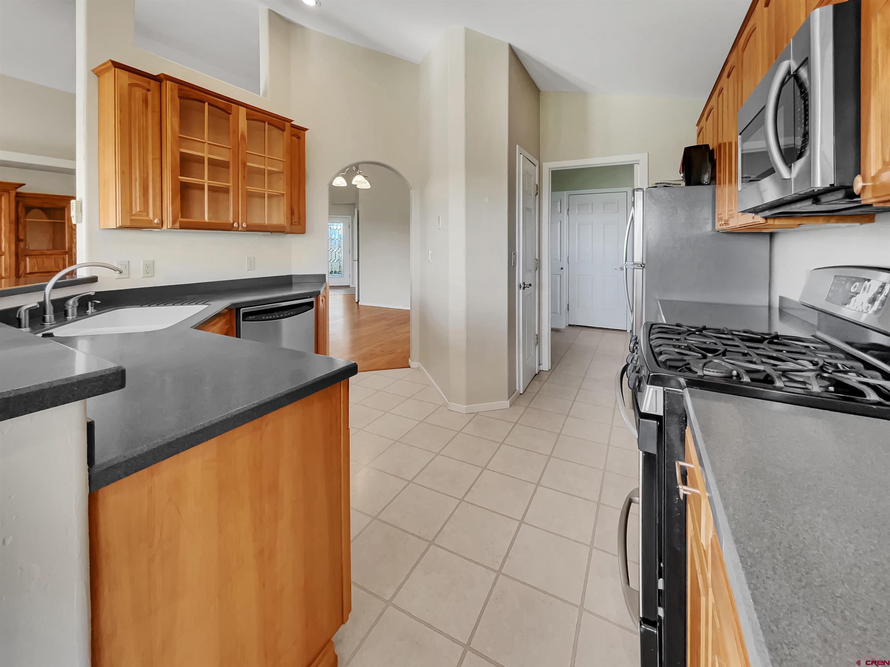 12863 24.4 Road Cortez, CO 81321 - Photo 11 of 35 a kitchen with stainless steel appliances granite countertop a sink and cabinets