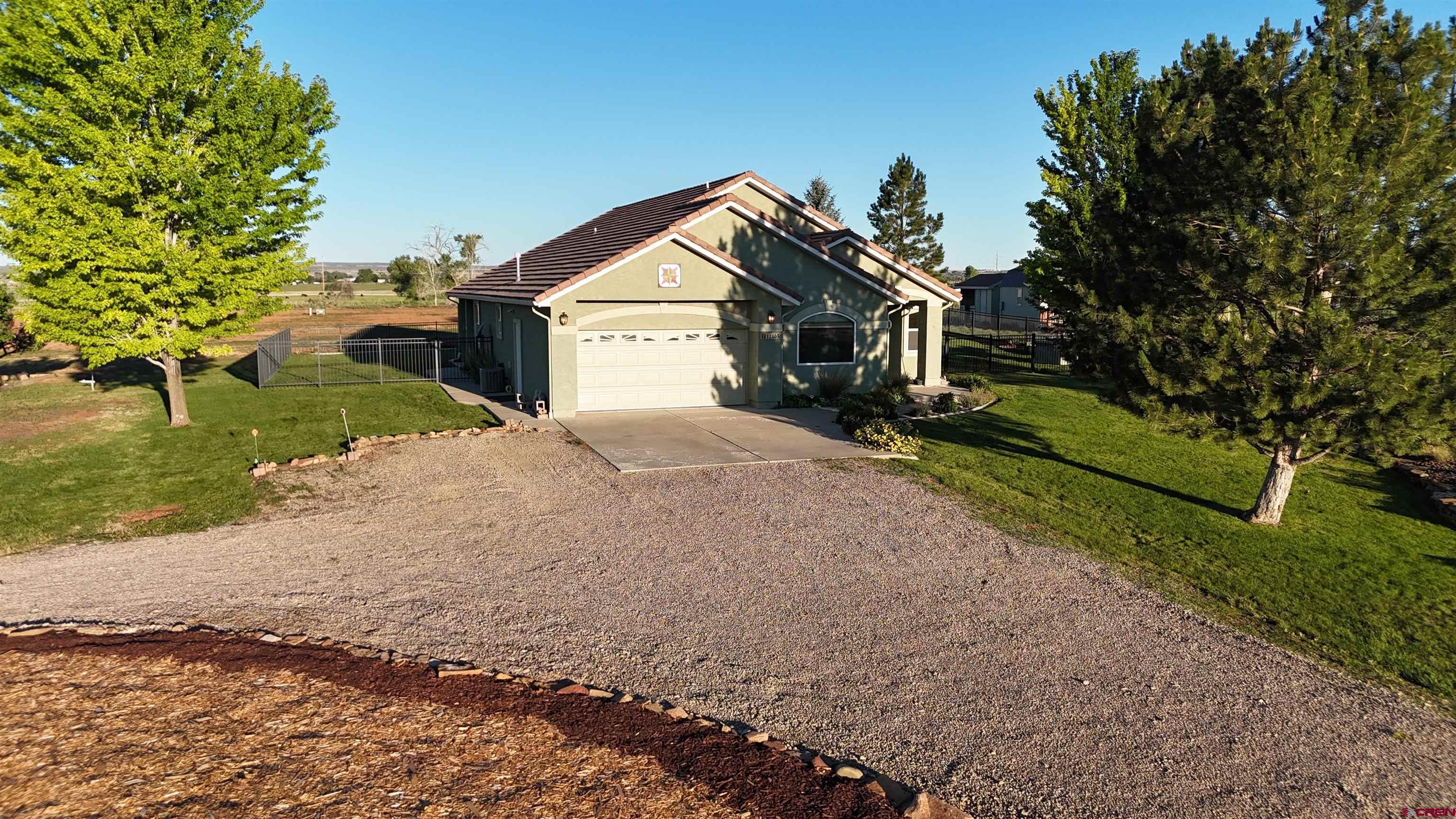 12863 24.4 Road Cortez, CO 81321 - Photo 2 of 35 a view of house with outdoor space