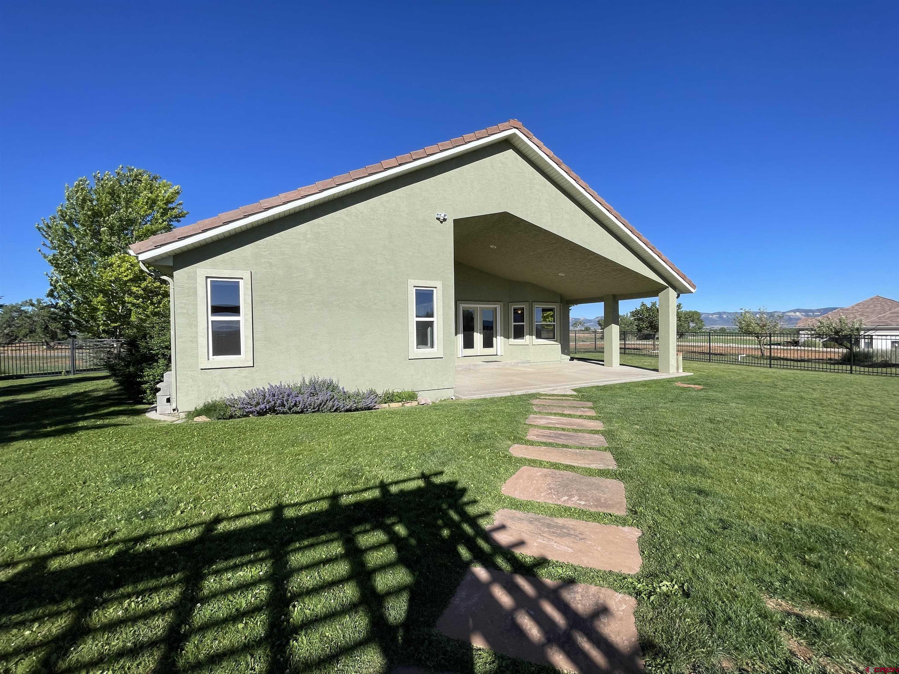 12863 24.4 Road Cortez, CO 81321 - Photo 24 of 35 a front view of a house with a yard