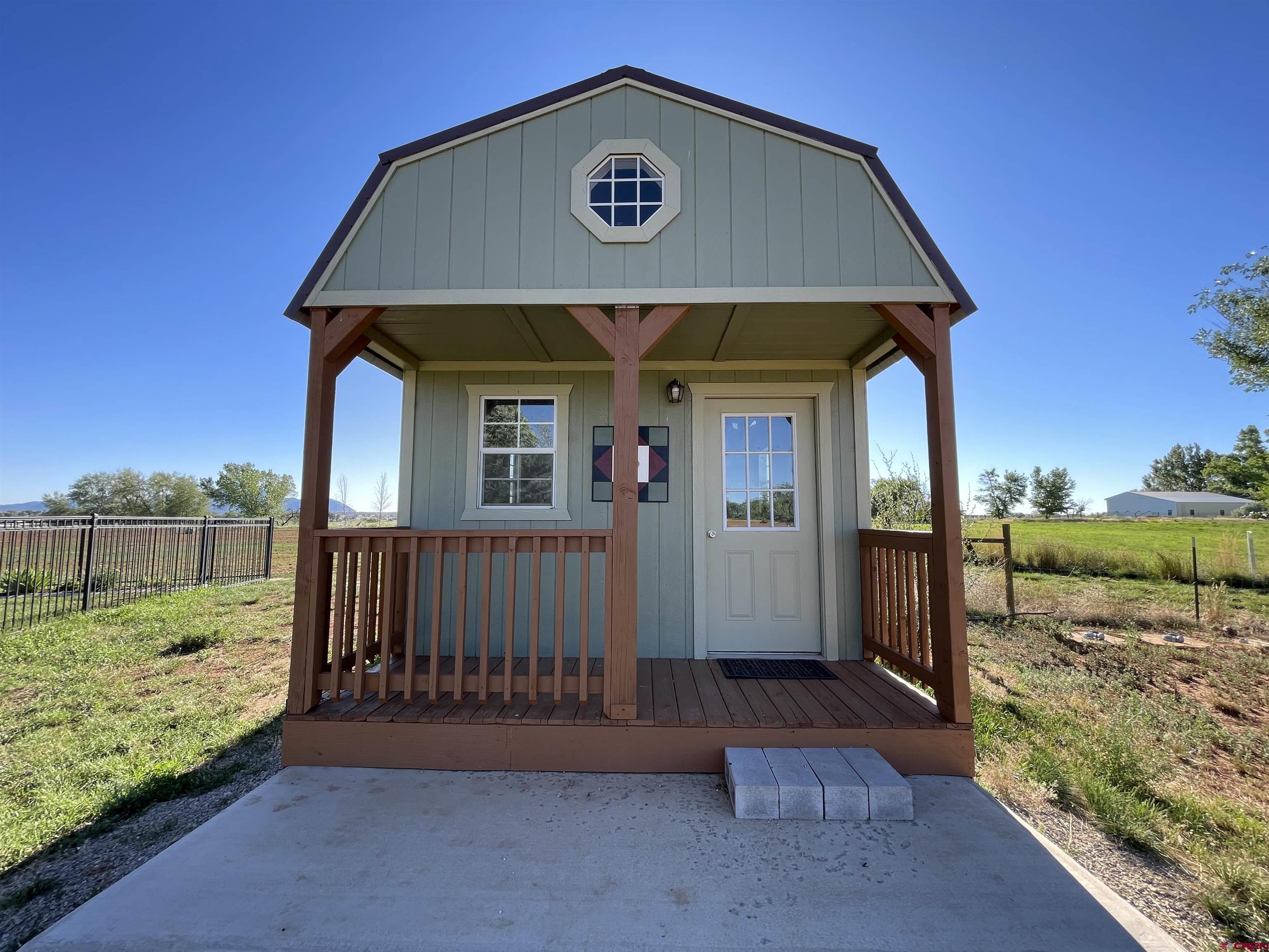 12863 24.4 Road Cortez, CO 81321 - Photo 31 of 35 a front view of a house with a yard