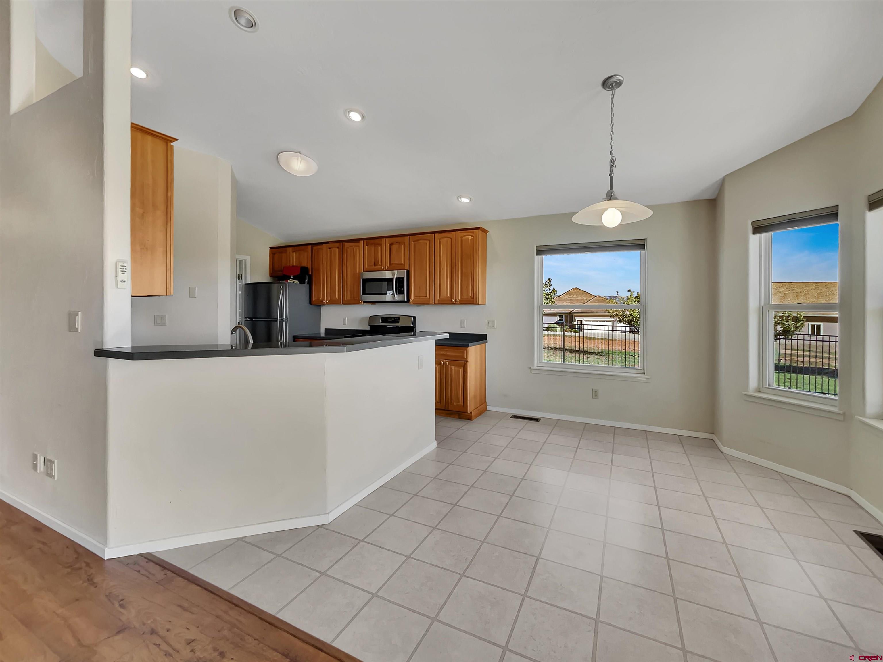 12863 24.4 Road Cortez, CO 81321 - Photo 8 of 35 a kitchen with stainless steel appliances a refrigerator sink and microwave