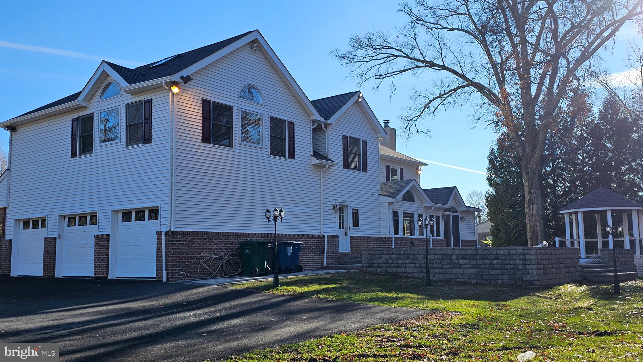 1217 McKean Road Ambler, PA 19002 - Photo 14 of 63 a front view of a house with a yard