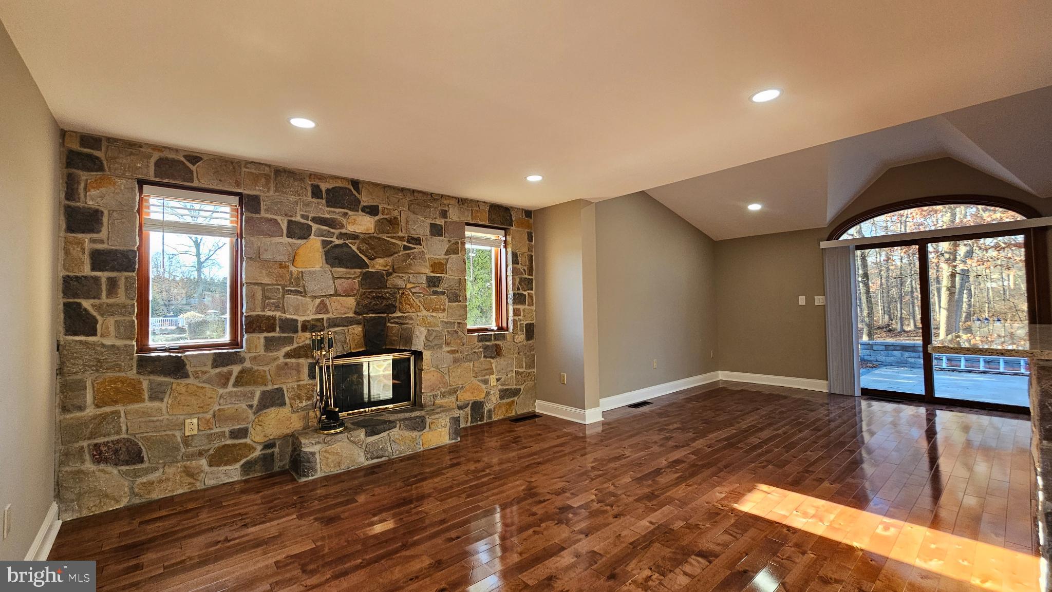 1217 McKean Road Ambler, PA 19002 - Photo 20 of 63 a view of a hallway with wooden floor and a fireplace