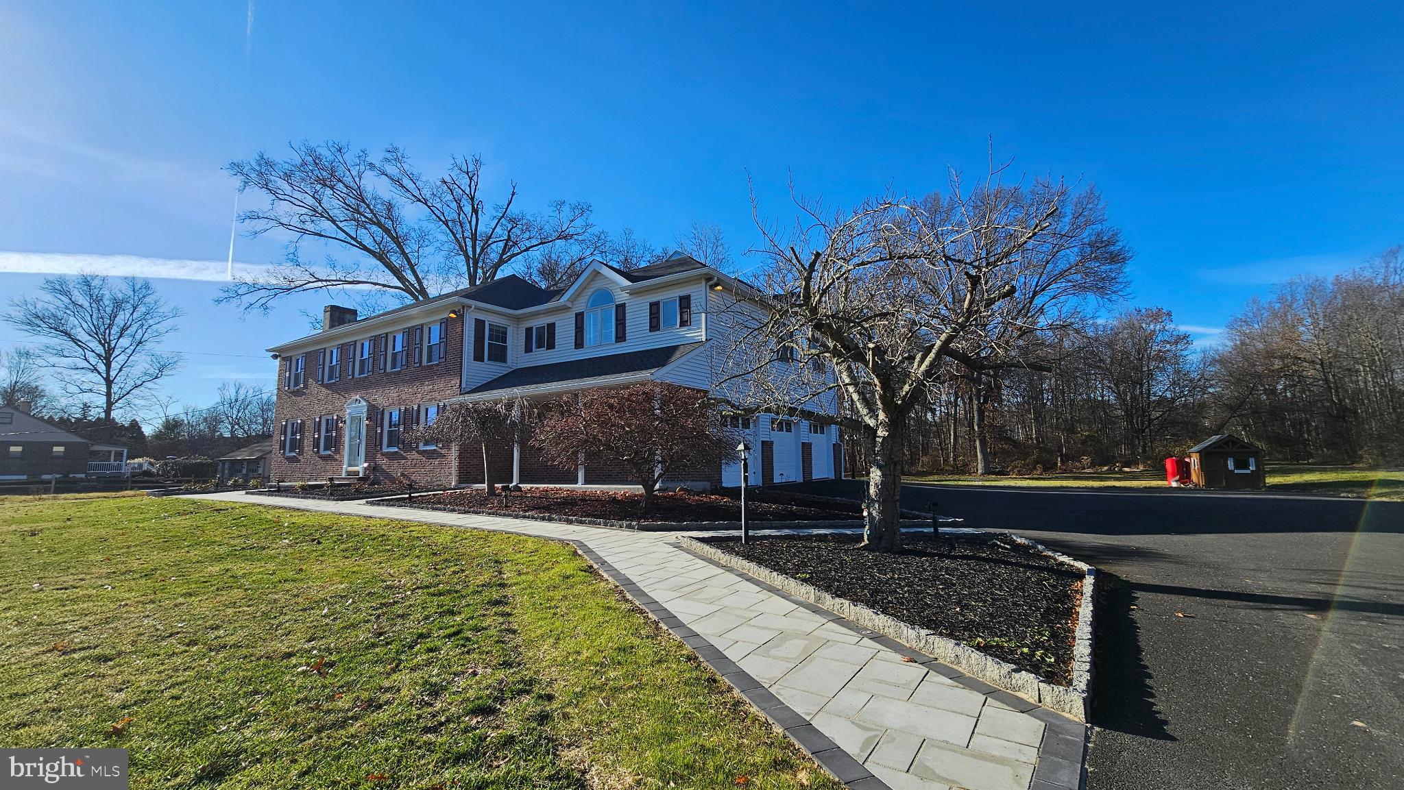 1217 McKean Road Ambler, PA 19002 - Photo 2 of 63 a front view of a house with a yard