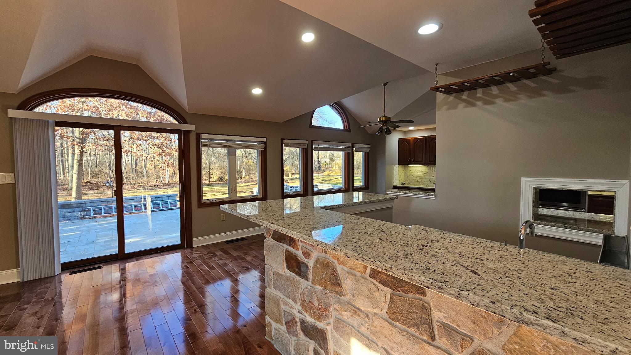 1217 McKean Road Ambler, PA 19002 - Photo 21 of 63 a large kitchen with kitchen island granite countertop a large window and stainless steel appliances