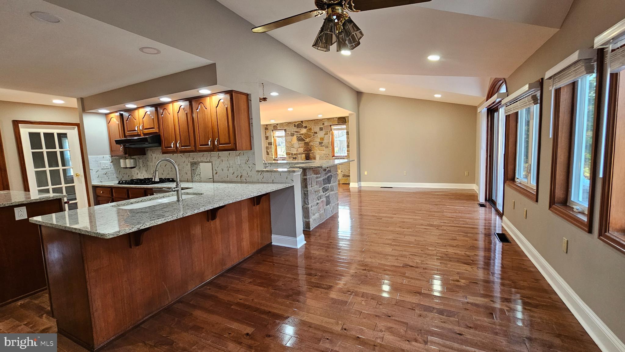 1217 McKean Road Ambler, PA 19002 - Photo 23 of 63 a large kitchen with kitchen island a large counter space a sink appliances and cabinets