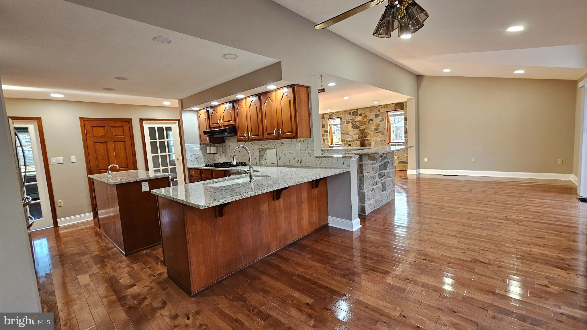 1217 McKean Road Ambler, PA 19002 - Photo 24 of 63 a kitchen with stainless steel appliances granite countertop a sink and a stove