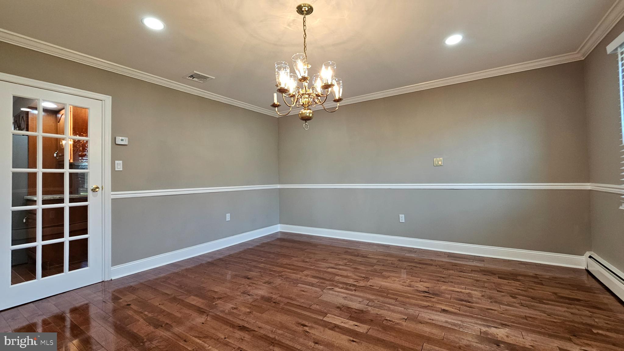 1217 McKean Road Ambler, PA 19002 - Photo 28 of 63 a view of an empty room with a window and chandelier fan