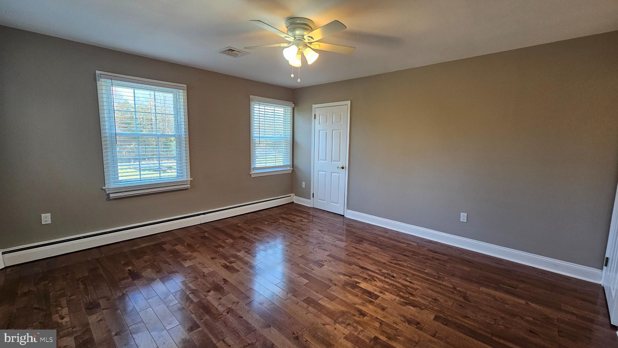 1217 McKean Road Ambler, PA 19002 - Photo 31 of 63 a view of empty room with wooden floor and fan