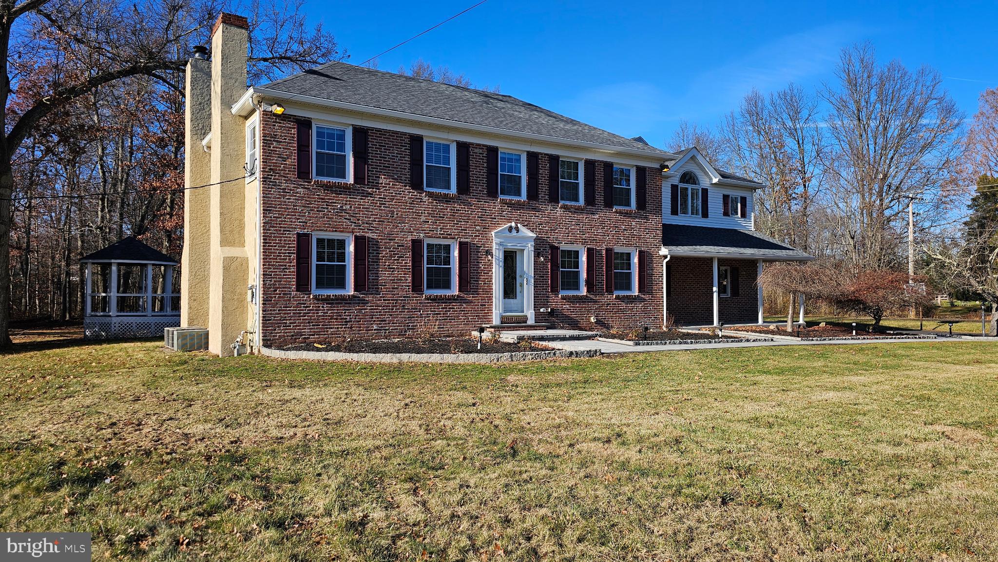 1217 McKean Road Ambler, PA 19002 - Photo 4 of 63 a front view of a house with swimming pool having outdoor seating