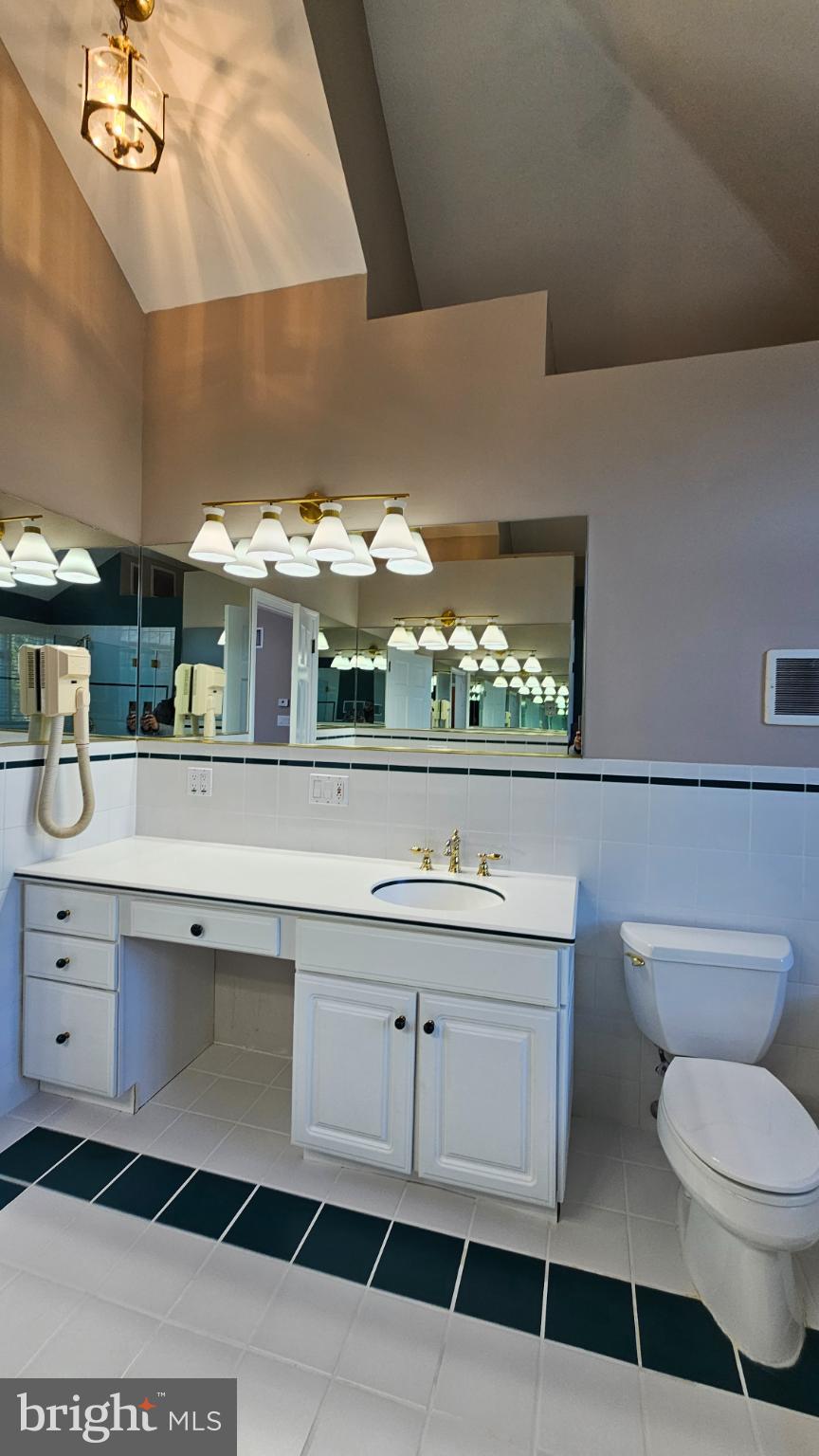 1217 McKean Road Ambler, PA 19002 - Photo 41 of 63 a bathroom with a sink a toilet and a mirror