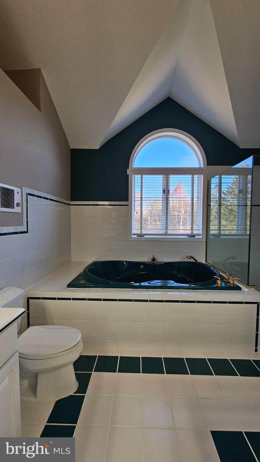 1217 McKean Road Ambler, PA 19002 - Photo 43 of 63 a living room with a toilet a sink and a large window