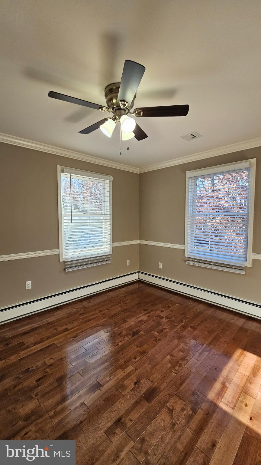 1217 McKean Road Ambler, PA 19002 - Photo 44 of 63 a view of an empty room with a window and wooden floor