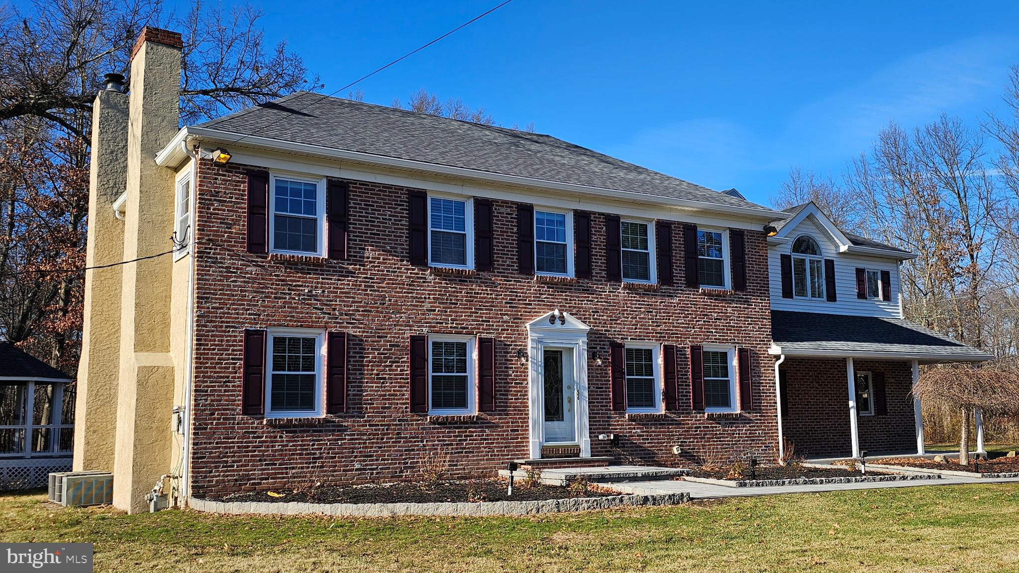 1217 McKean Road Ambler, PA 19002 - Photo 5 of 63 a front view of a house with large windows