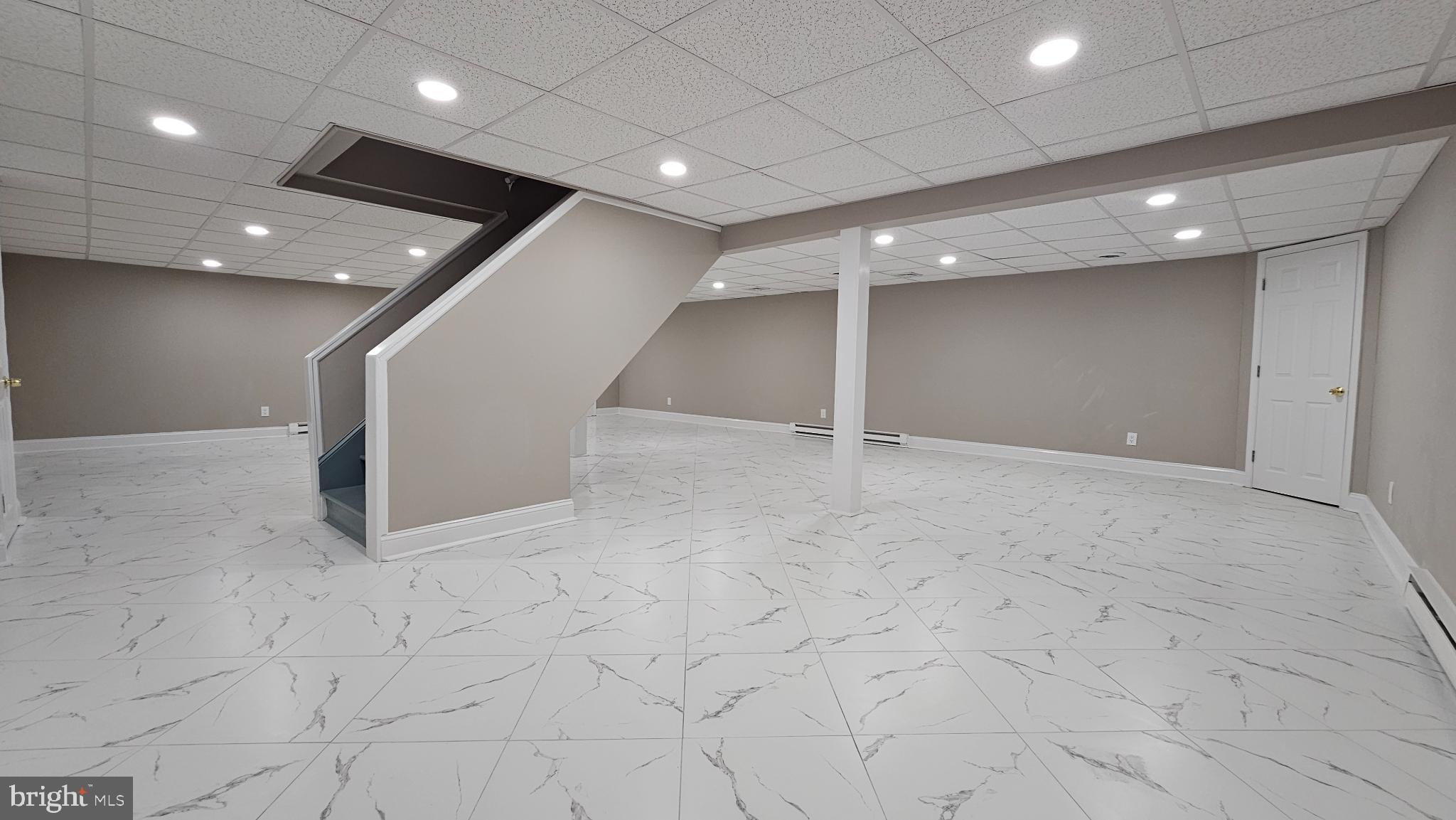 1217 McKean Road Ambler, PA 19002 - Photo 61 of 63 an empty room with wooden floor