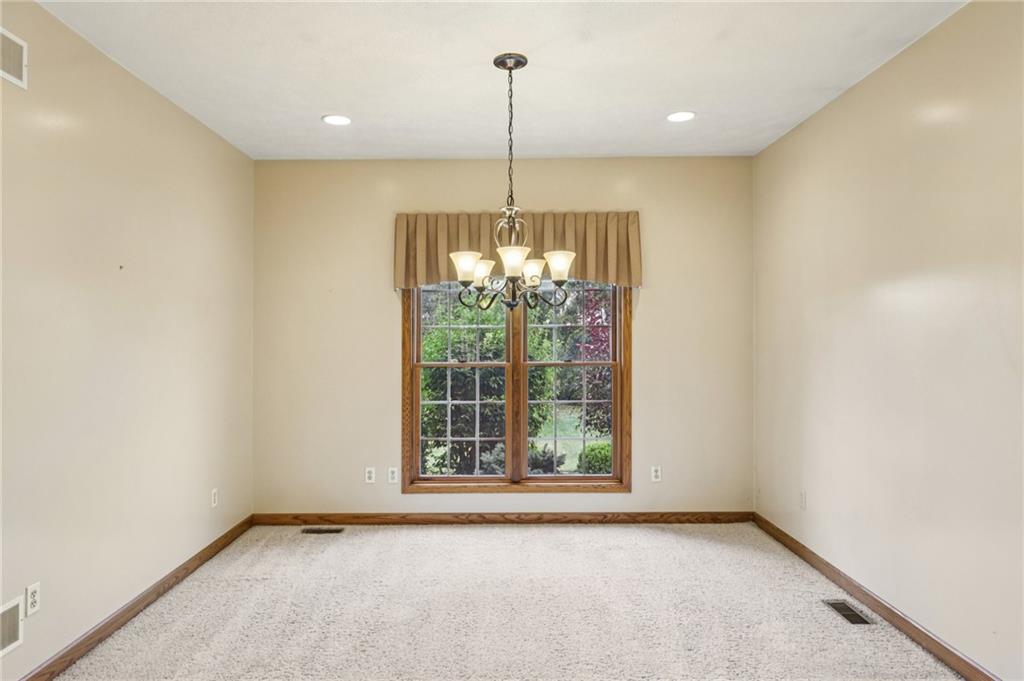 2210 Skyhill Road Edinburg, PA 16116 - Photo 12 of 49 a view of an empty room with windows and outdoor view