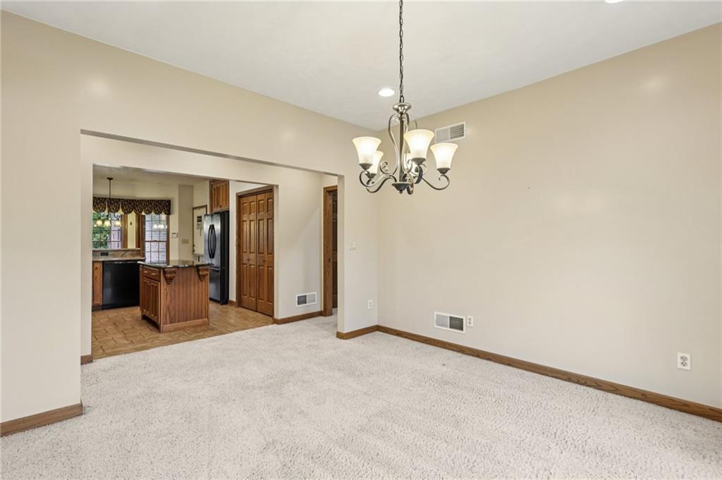 2210 Skyhill Road Edinburg, PA 16116 - Photo 13 of 49 a view of a livingroom with a chandelier fan