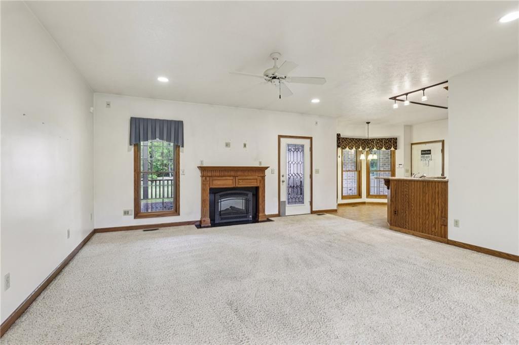 2210 Skyhill Road Edinburg, PA 16116 - Photo 15 of 49 an empty room with furniture and a fireplace