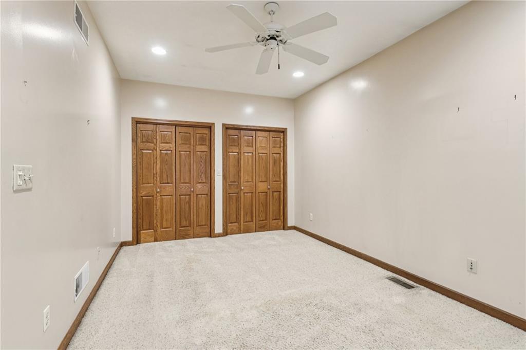 2210 Skyhill Road Edinburg, PA 16116 - Photo 28 of 49 an empty room with windows and fan