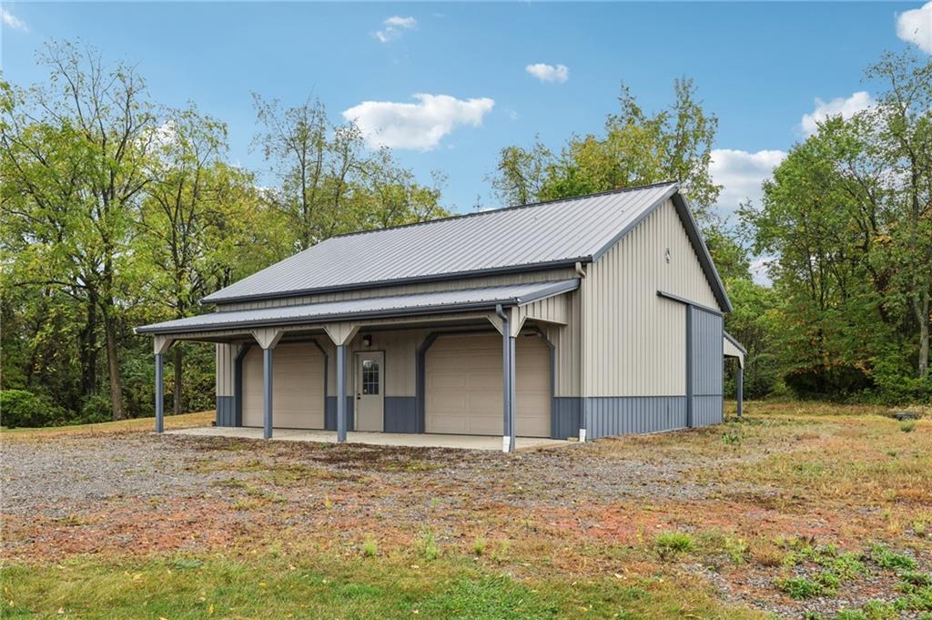 2210 Skyhill Road Edinburg, PA 16116 - Photo 34 of 49 a view of a house with a yard