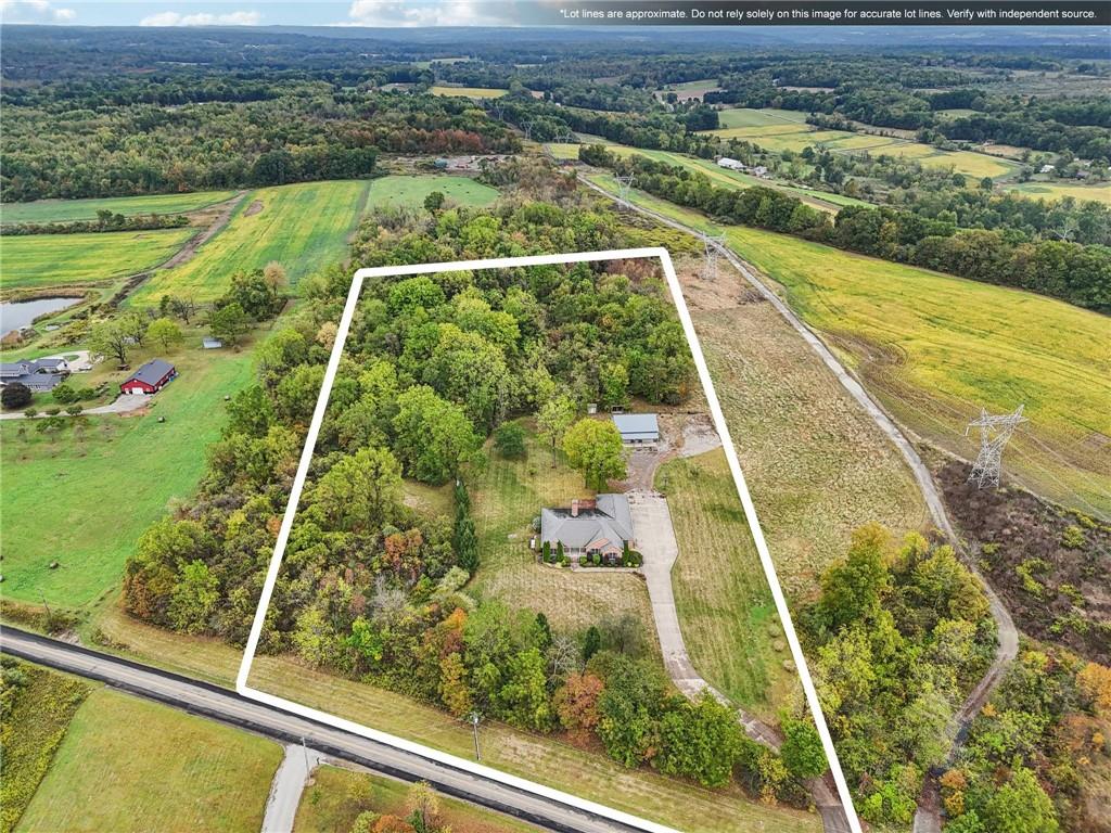 2210 Skyhill Road Edinburg, PA 16116 - Photo 46 of 49 a view of a yard with an outdoor seating