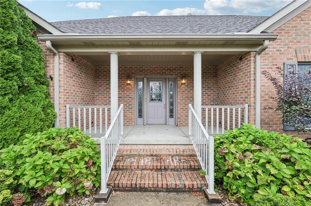 2210 Skyhill Road Edinburg, PA 16116 - Photo 5 of 49 front view of a house with a porch