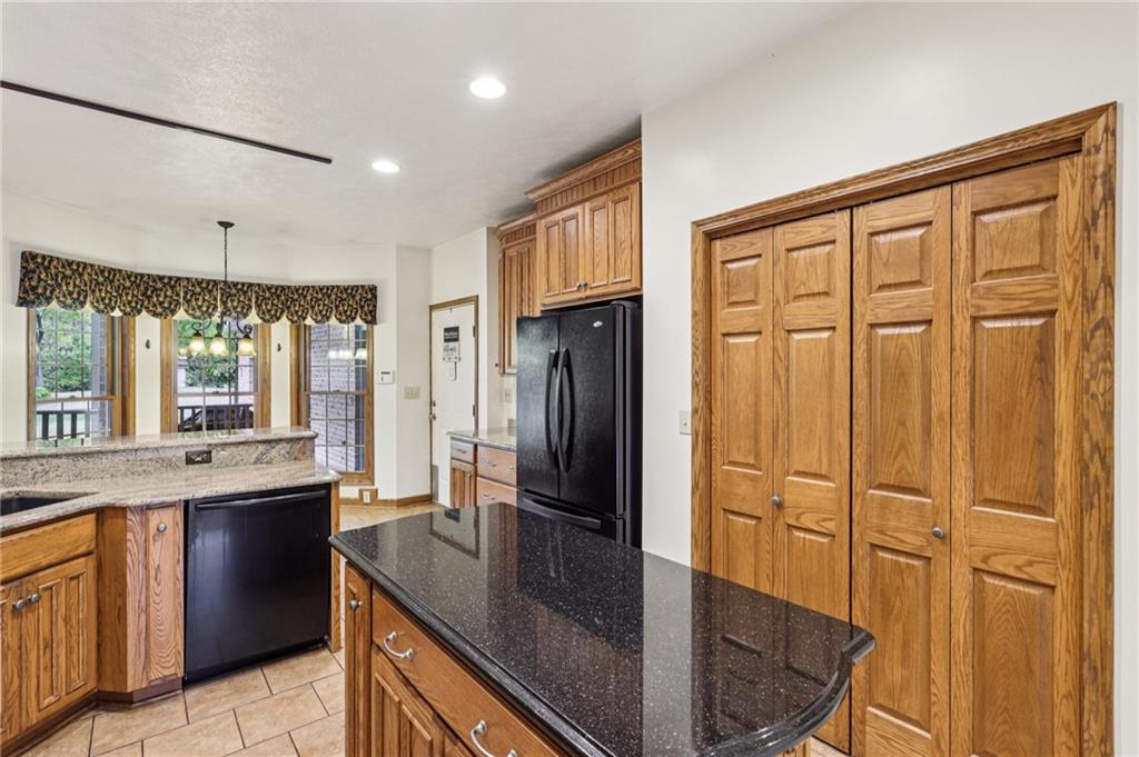 2210 Skyhill Road Edinburg, PA 16116 - Photo 8 of 49 a kitchen with stainless steel appliances granite countertop a refrigerator a sink and a stove