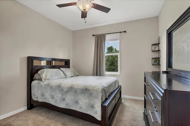 a view of a house with backyard and porch