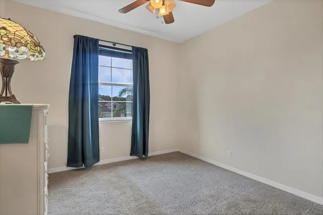 an aerial view of a house with garden space and street view