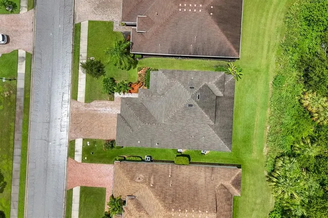 an aerial view of a house with a garden