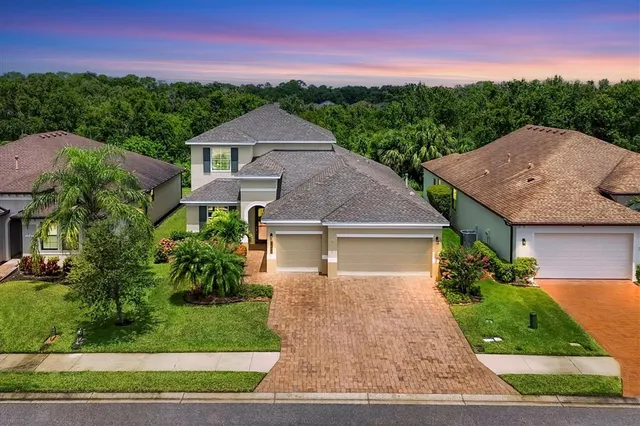 an aerial view of a house with a garden