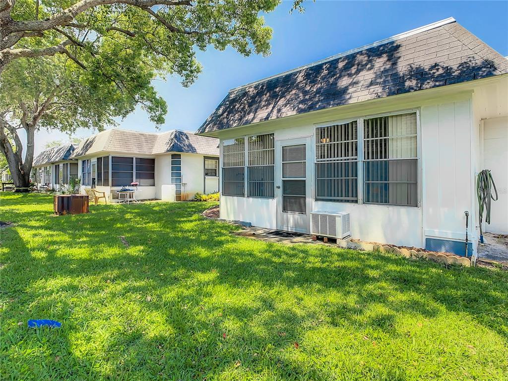 4230 Redcliff Place, Unit 4230 New Port Richey, FL 34652 - Photo 35 of 42 front view of a house with a yard