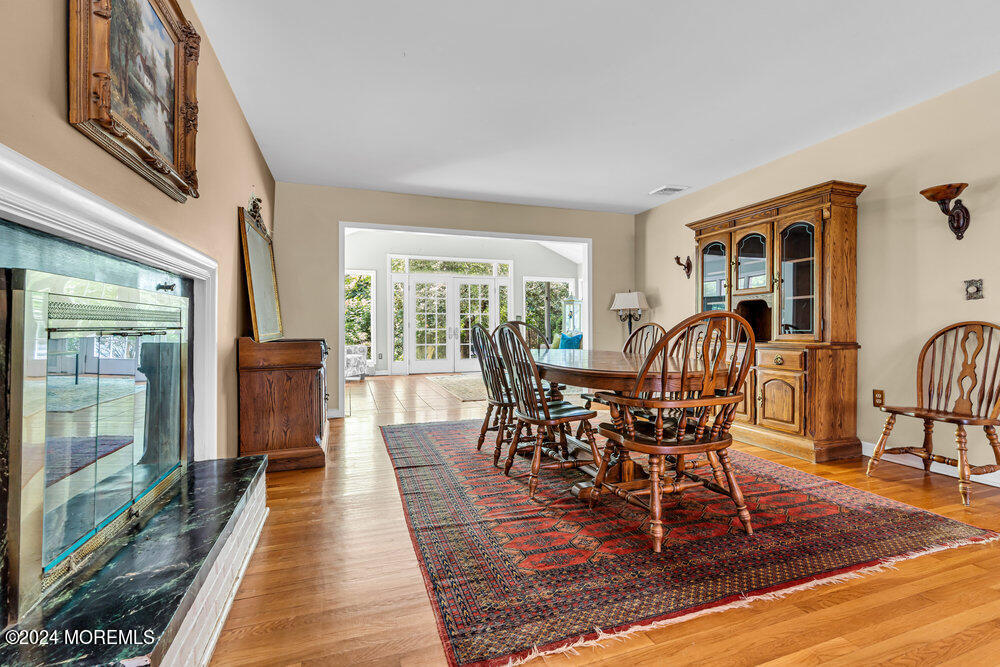 5 Clover Lane Rumson, NJ 07760 - Photo 5 of 12 a view of a dining room with furniture and wooden floor