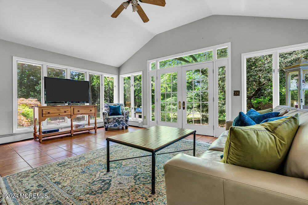 5 Clover Lane Rumson, NJ 07760 - Photo 7 of 12 a living room with furniture and a flat screen tv