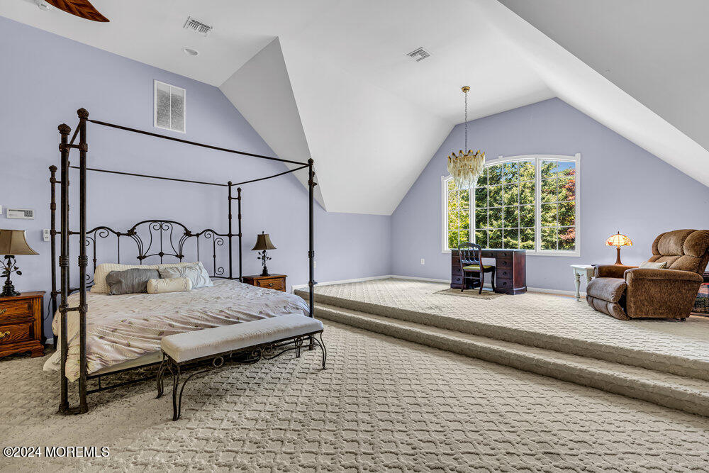 5 Clover Lane Rumson, NJ 07760 - Photo 9 of 12 a bedroom with a bed and a potted plant on the dresser