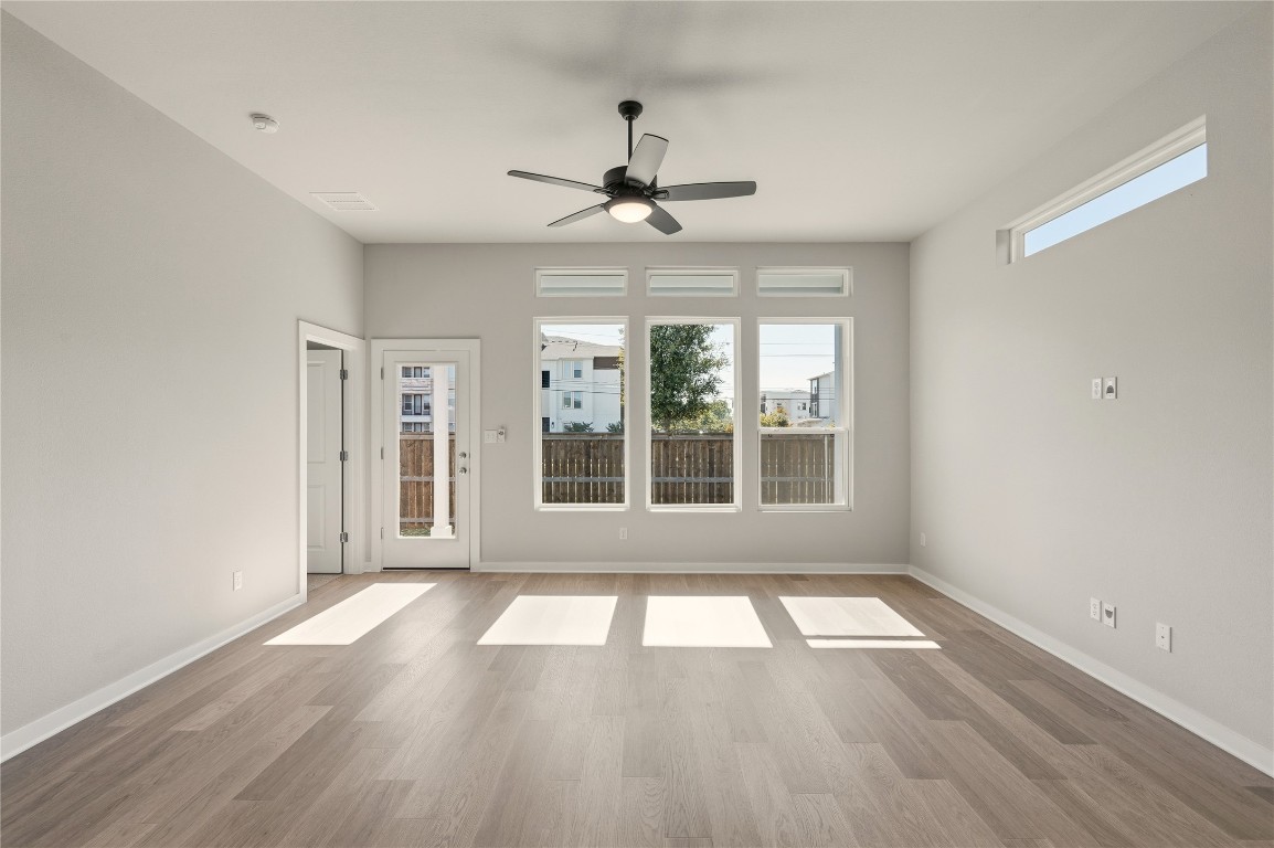 2206 Luna Azul View, Unit 78 Round Rock, TX 78664 - Photo 11 of 31 Spare room with wood finished floors and a ceiling fan