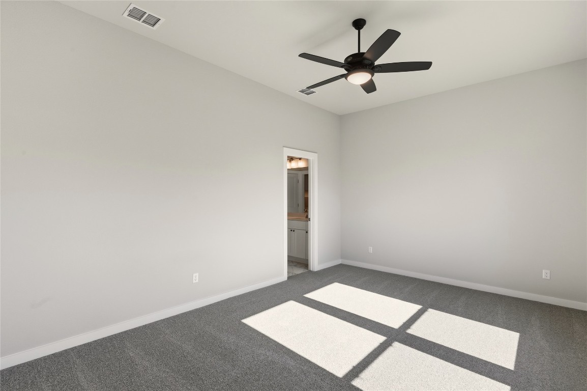 2206 Luna Azul View, Unit 78 Round Rock, TX 78664 - Photo 15 of 31 Spare room featuring carpet floors and a ceiling fan