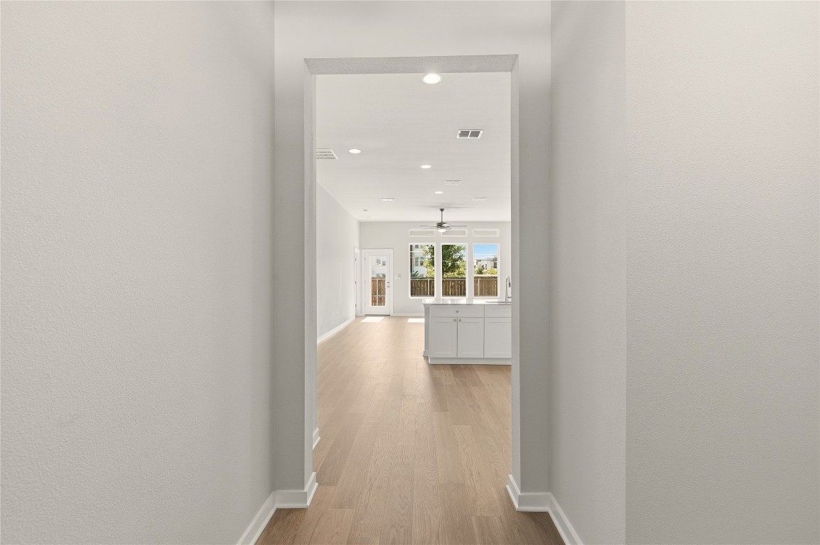 2206 Luna Azul View, Unit 78 Round Rock, TX 78664 - Photo 4 of 31 Hallway with light wood-style flooring and recessed lighting
