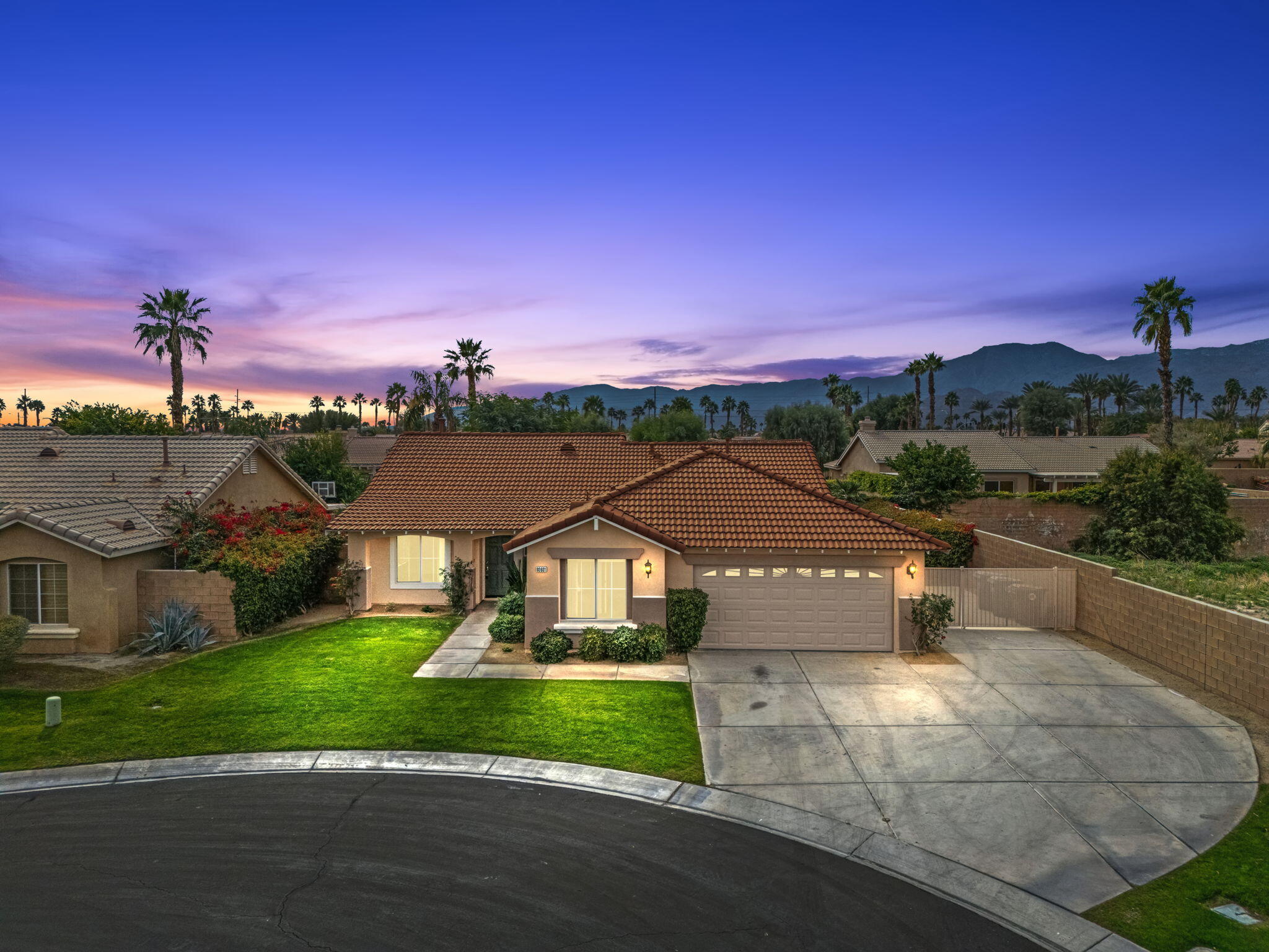 80601 Declaration Avenue Indio, CA 92201 - Photo 1 of 52 a view of a street with a house in the background