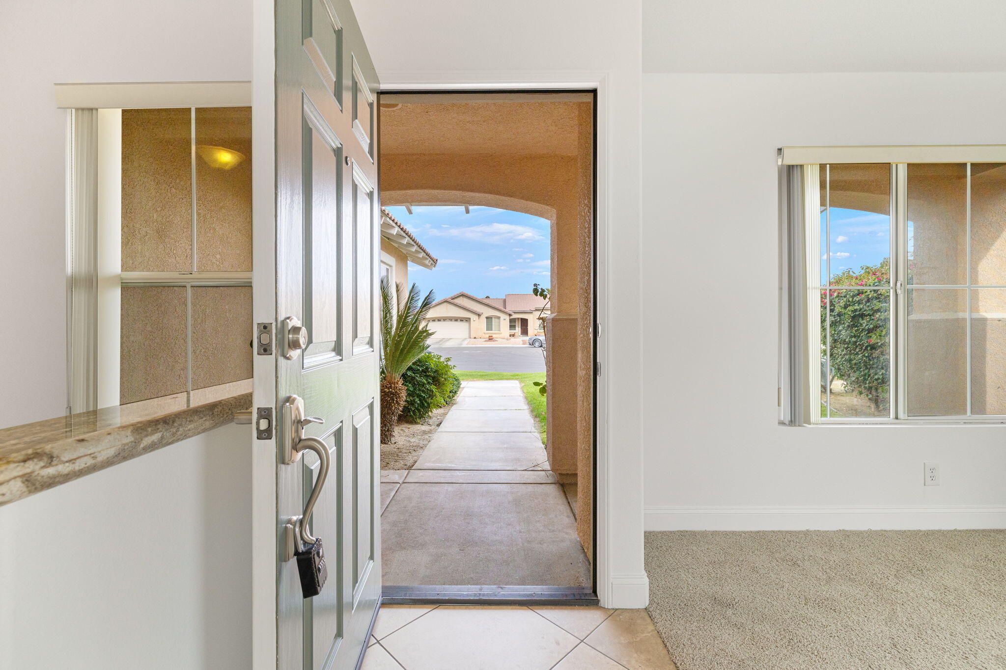 80601 Declaration Avenue Indio, CA 92201 - Photo 15 of 52 a hallway with sliding door and front door