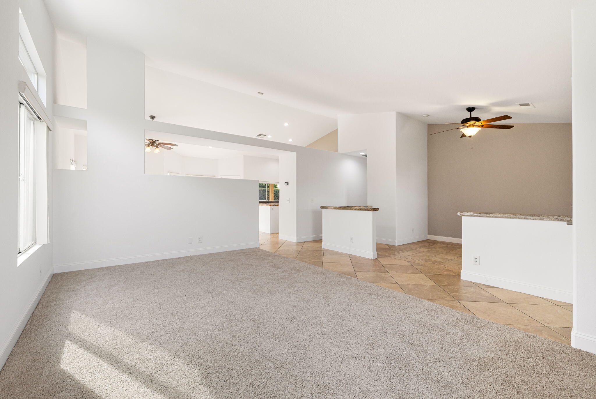 80601 Declaration Avenue Indio, CA 92201 - Photo 16 of 52 an empty room with a white cabinet and mirrors