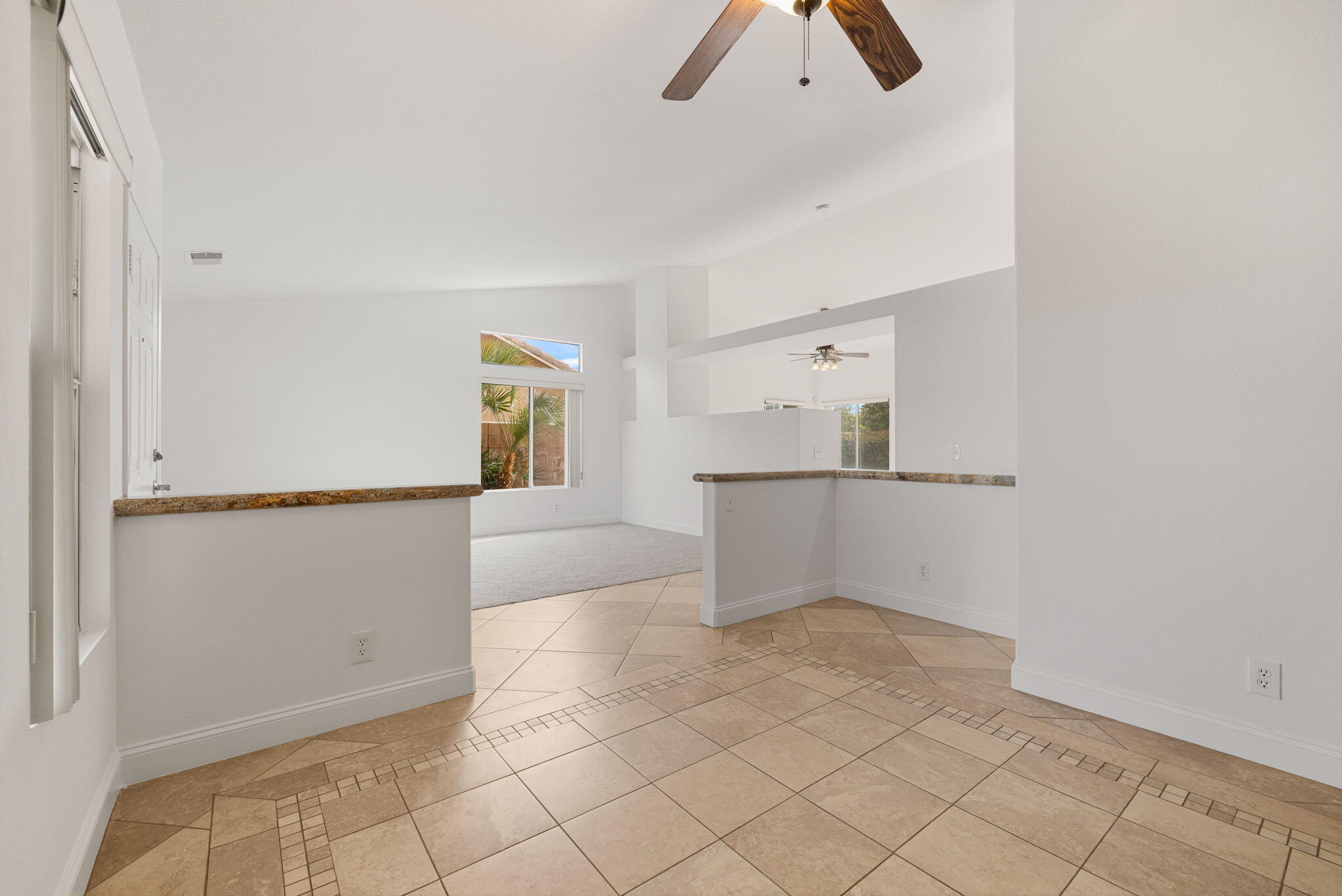 80601 Declaration Avenue Indio, CA 92201 - Photo 18 of 52 wooden floor in an empty room with a cabinet and a window