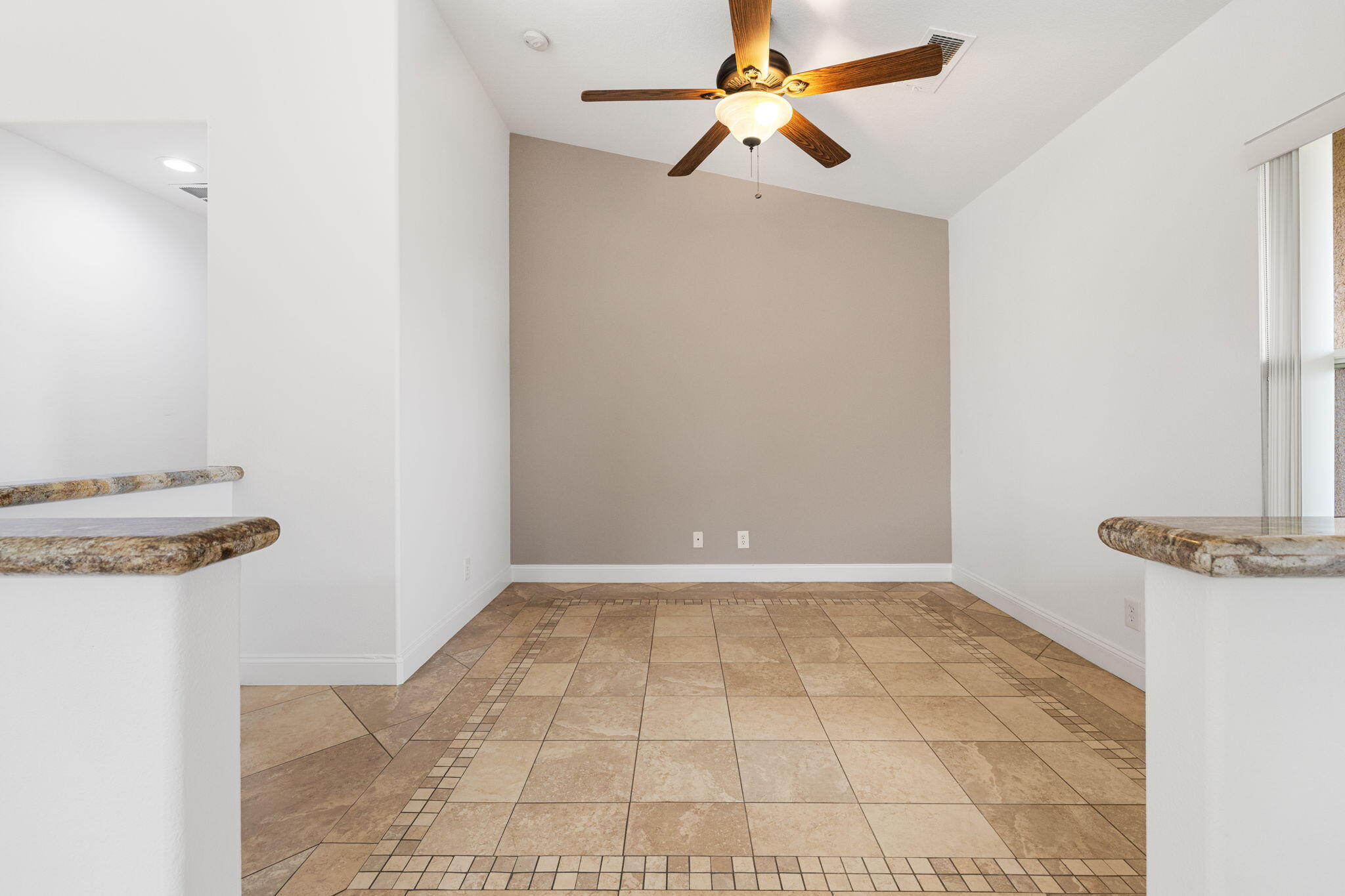 80601 Declaration Avenue Indio, CA 92201 - Photo 19 of 52 a view of a chandelier fan and kitchen view