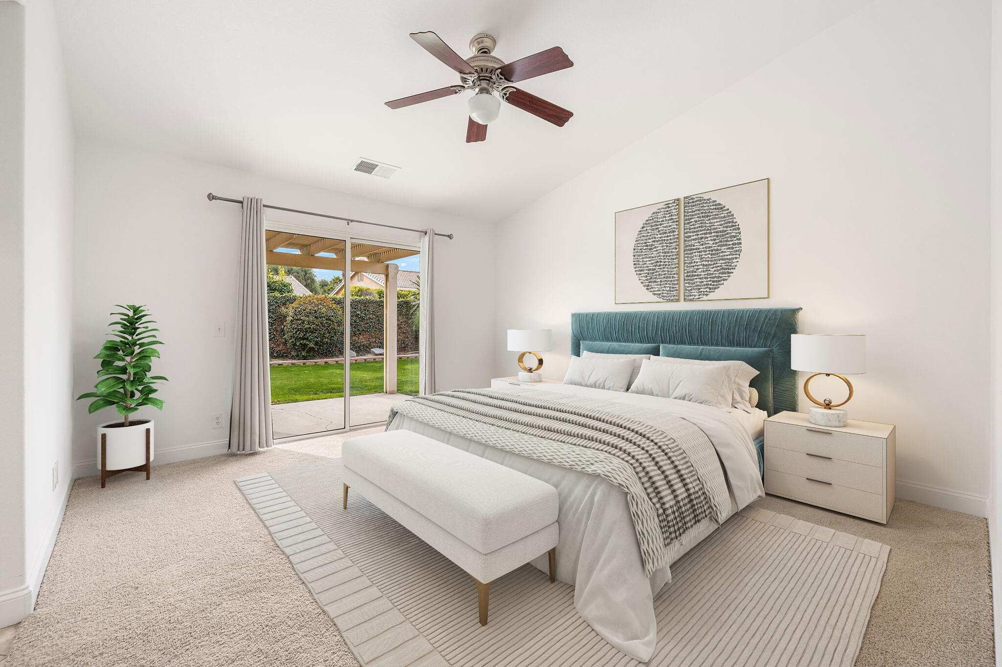 80601 Declaration Avenue Indio, CA 92201 - Photo 3 of 52 a bed room with a bed and a potted plant