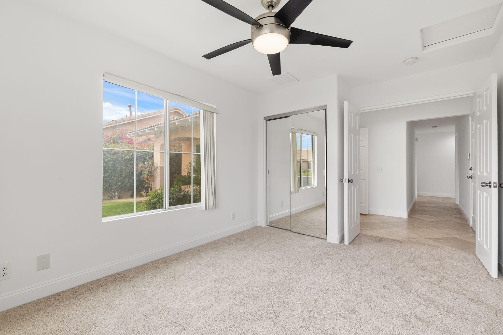 80601 Declaration Avenue Indio, CA 92201 - Photo 35 of 52 an empty room with ceiling fan and windows