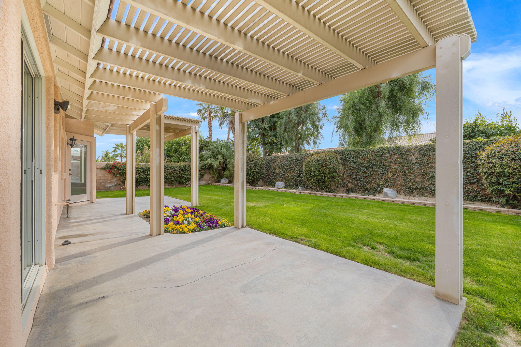 80601 Declaration Avenue Indio, CA 92201 - Photo 37 of 52 a view of an house with backyard and porch